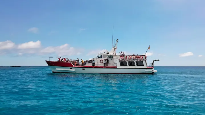 Ferry Isla de Lobos crossing turquoise water near Corralejo
